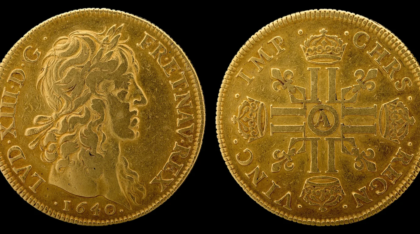 Both faces of a 1640 French gold coin, a laureate royal profile on one side and a cross of crowned monograms on the other, on black.