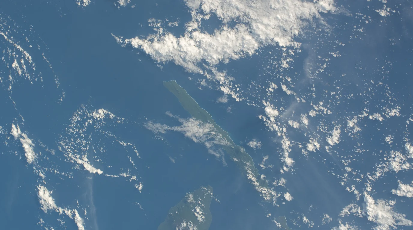 The islands of Vanuatu seen from the International Space Station through scattered cloud.