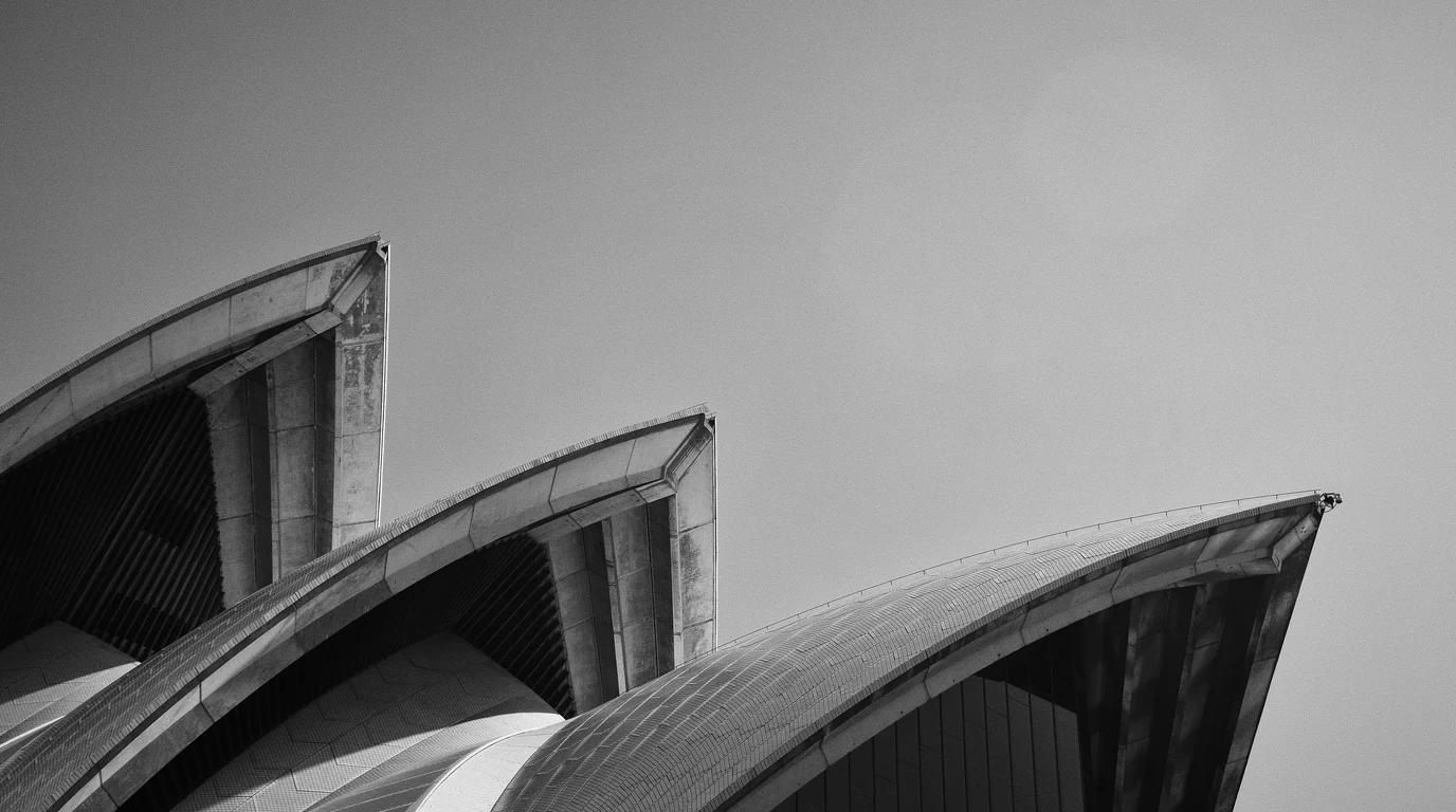 Black-and-white close-up of the shell roofs of the Sydney Opera House.